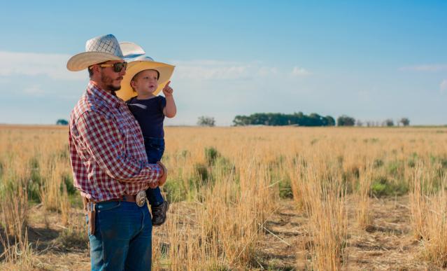 livestock farmer with baby